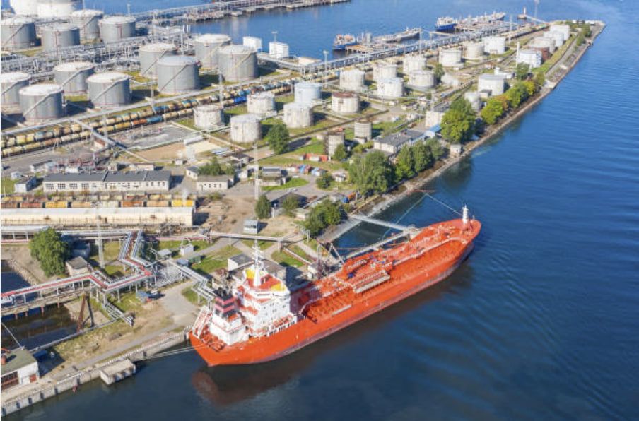 Product tanker berthed at a coastal tank terminal